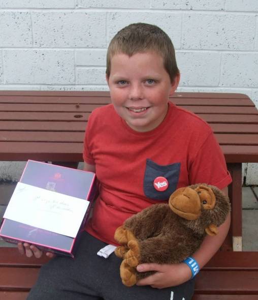 Colin collecting his prize xx